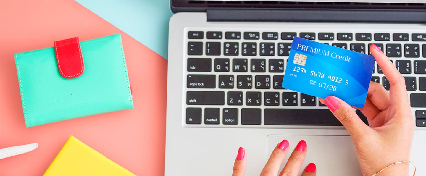 Woman securely entering credit card on online website