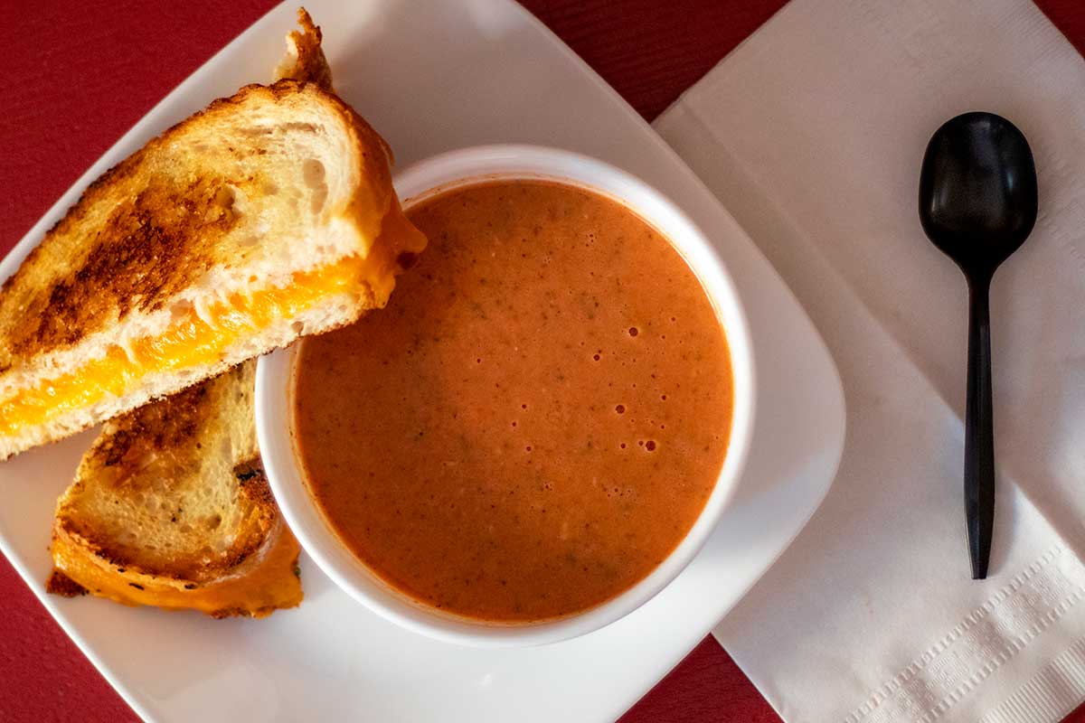Food photography gourmet grilled cheese with homemade tomato basil soup